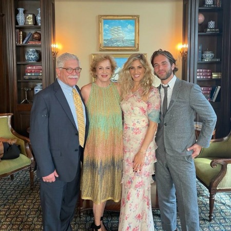 well-dressed Jonathan Zeizel with his parents.